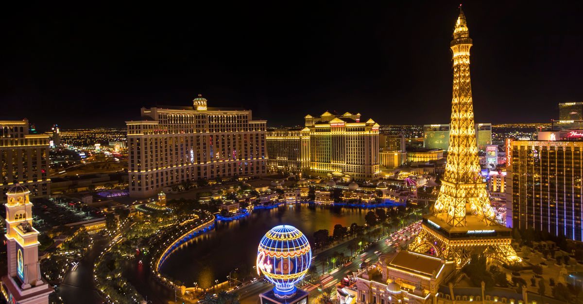 Stunning nighttime aerial view of the Las Vegas Strip featuring the Eiffel Tower replica.